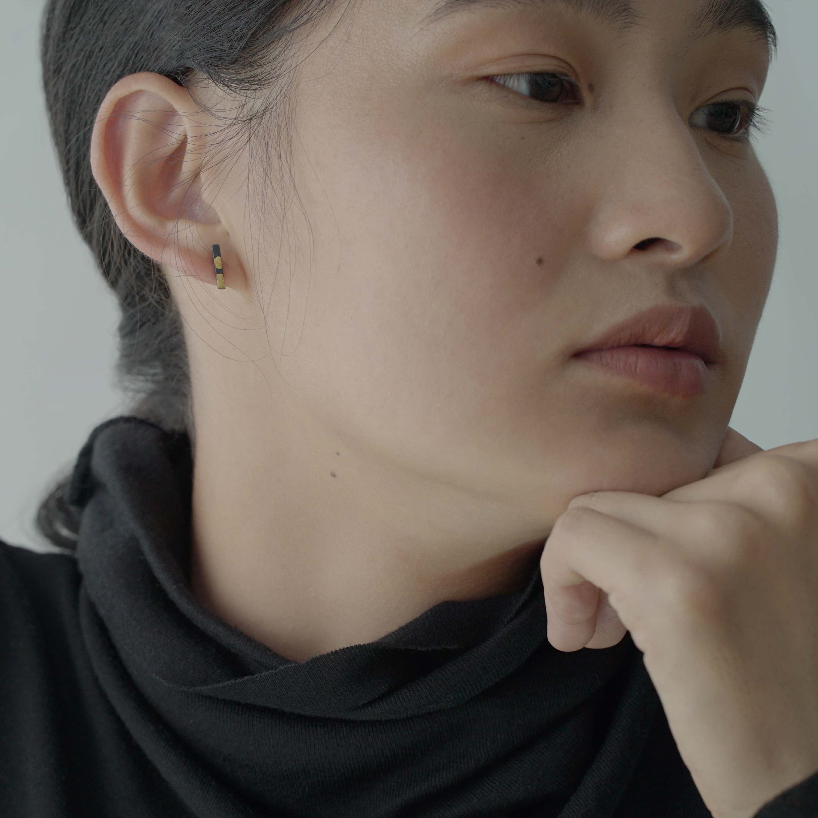 Small line studs with 18k gold touches