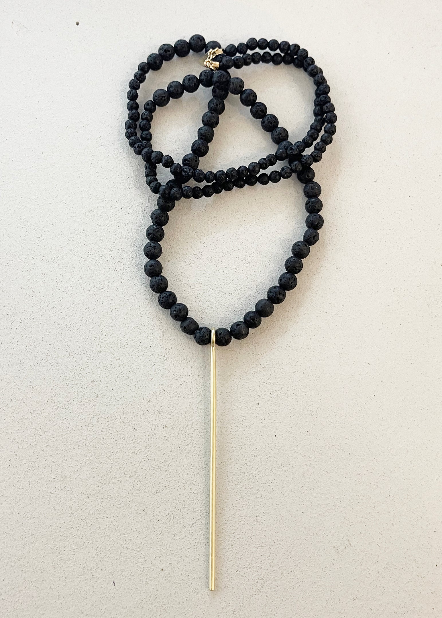 BLACK LAVE BEADS NECKLACE W/LINE PENDANT