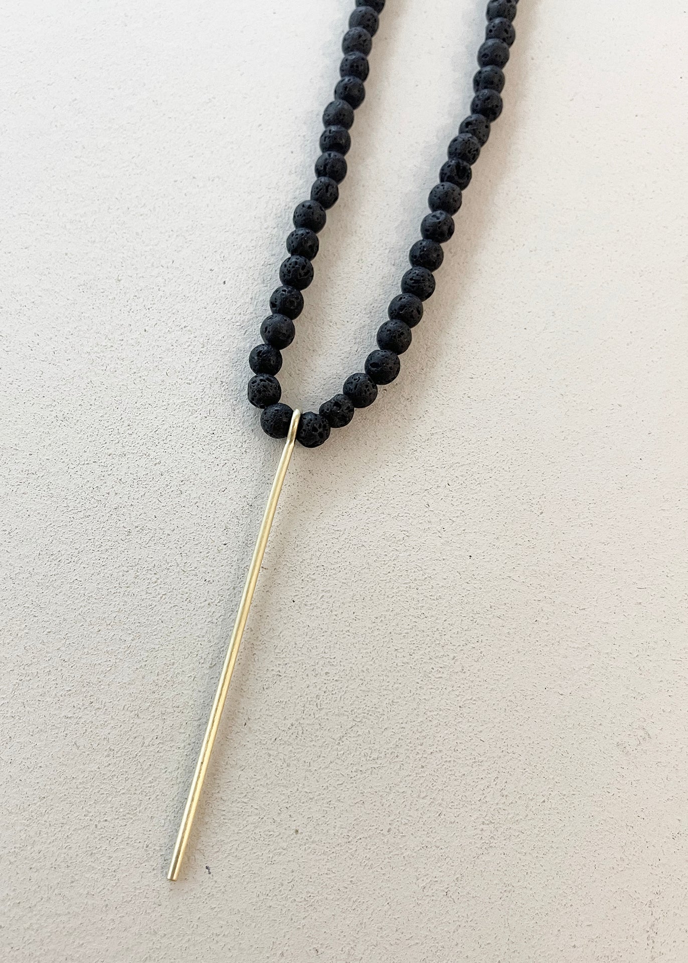 BLACK LAVE BEADS NECKLACE W/LINE PENDANT