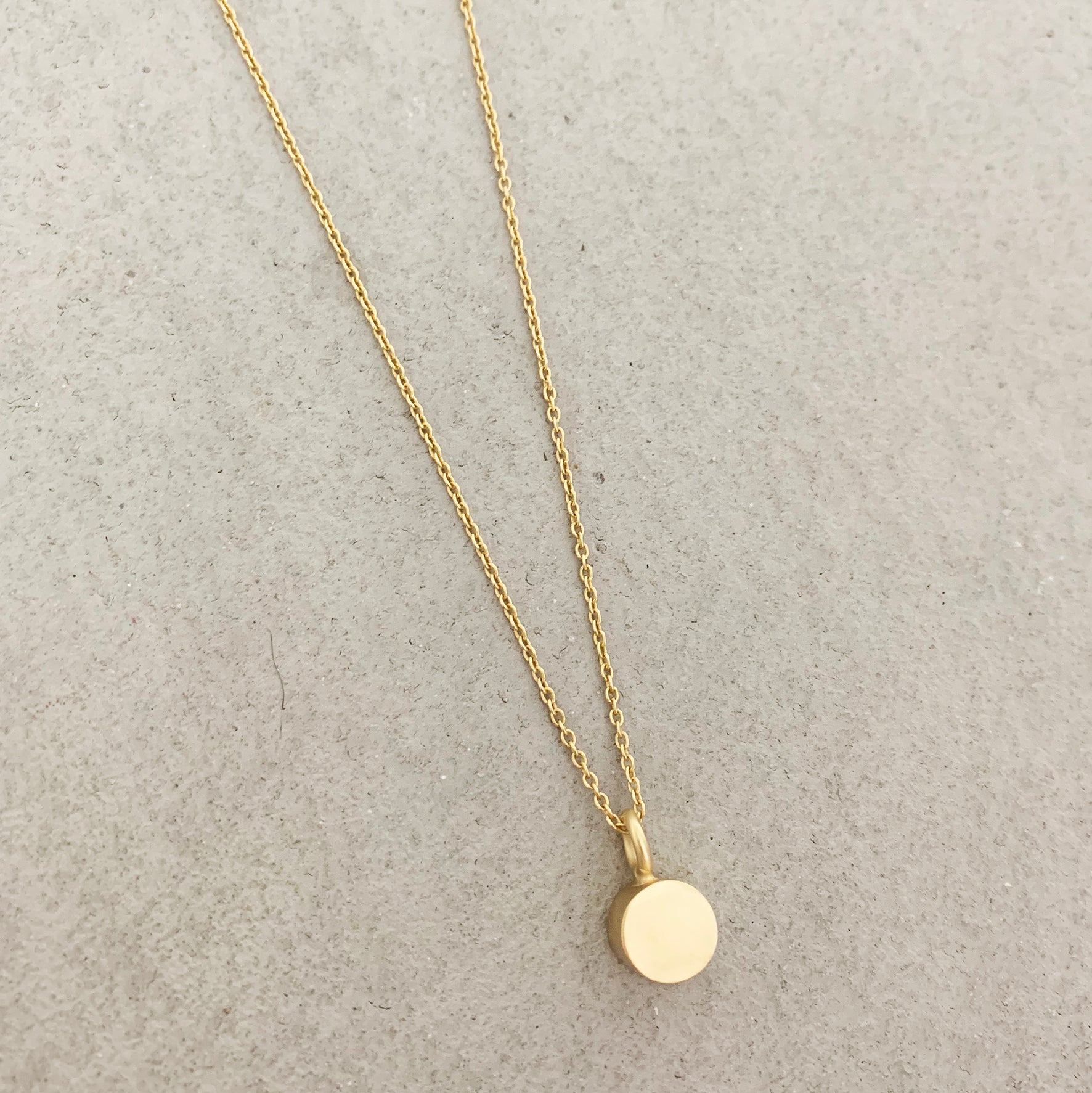 GOLD CYLINDER NECKLACE