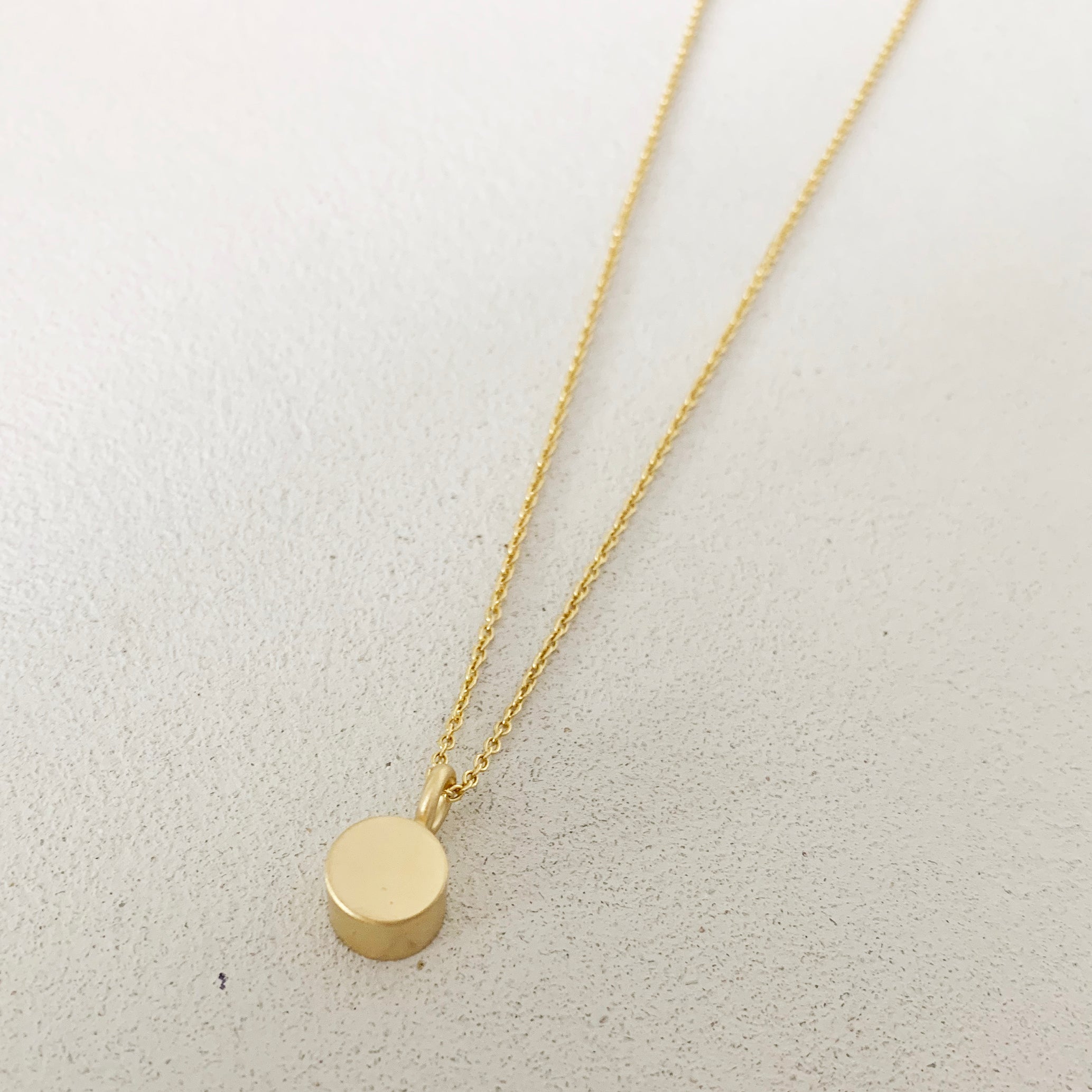 GOLD CYLINDER NECKLACE